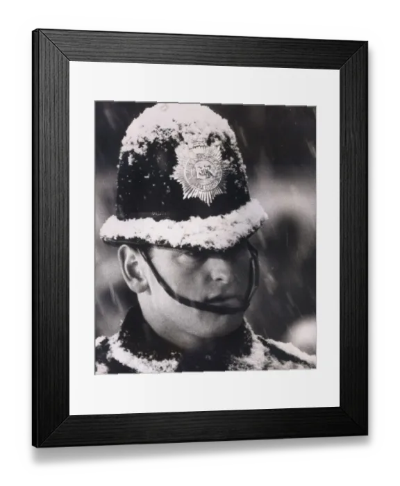 Framed Print : Policeman on duty at the Arsenal v Sheffield Wednesday football match at Highbury covered