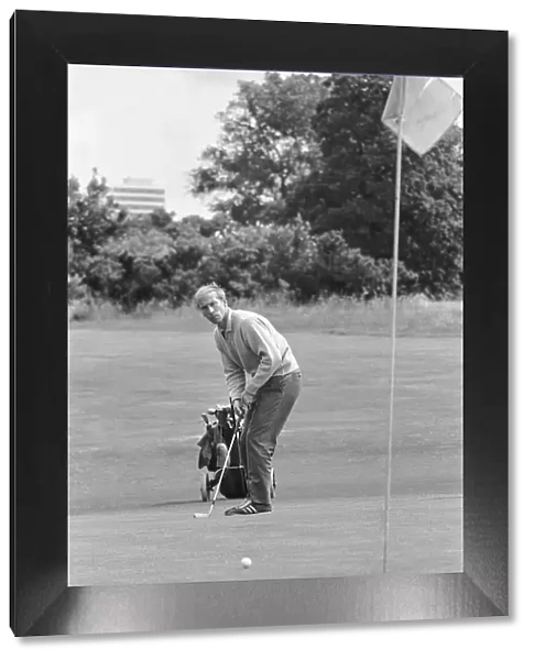 England footballer Bobby Charlton enjoys a round of golf during an England team get