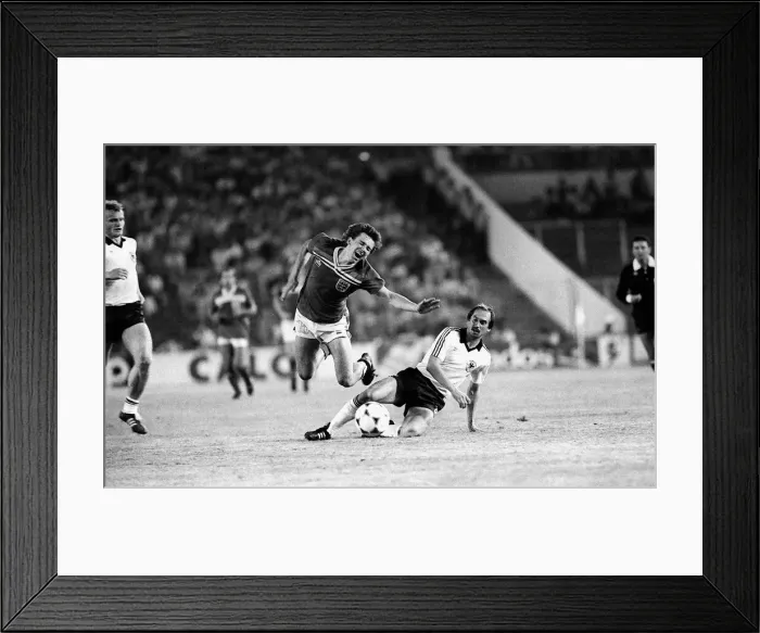 Framed Print : Bryan Robson is fouled by Uli Stielike during England v West Germany during world cup
