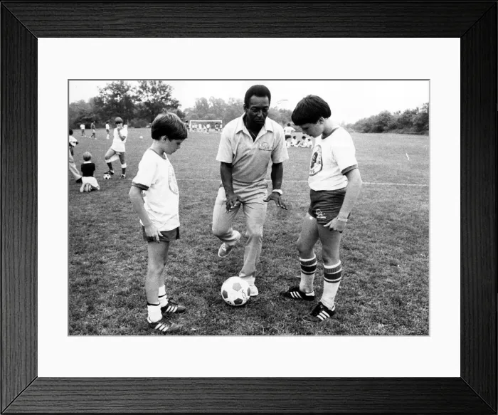 Framed Print : Brazilian football star Pele ashowing off his skills to American youngsters at his soccer Framed Print : Brazilian football star Pele ashowing off his skills to American youngsters at his soccer