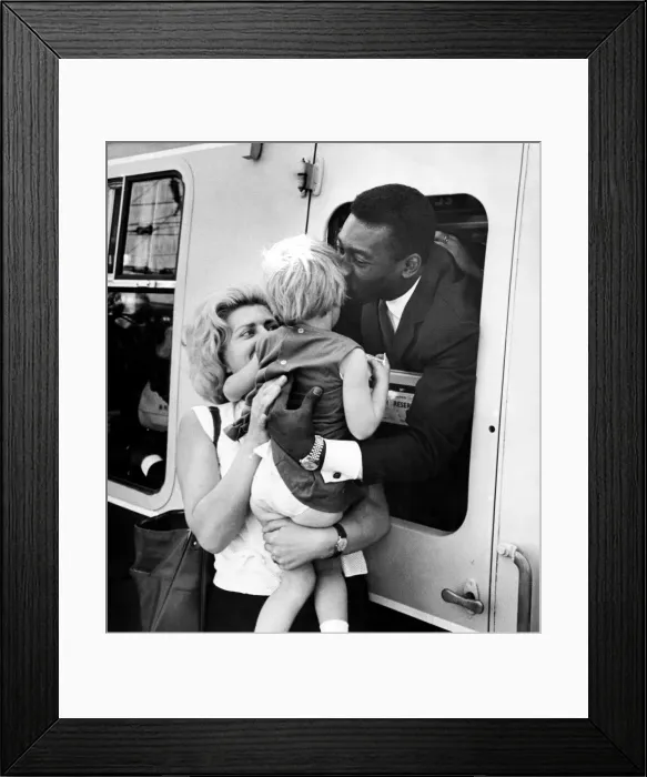 Framed Print : Brazilian football star Pele gives a parting kiss to three year old girl Virginia Ferrari Framed Print : Brazilian football star Pele gives a parting kiss to three year old girl Virginia Ferrari