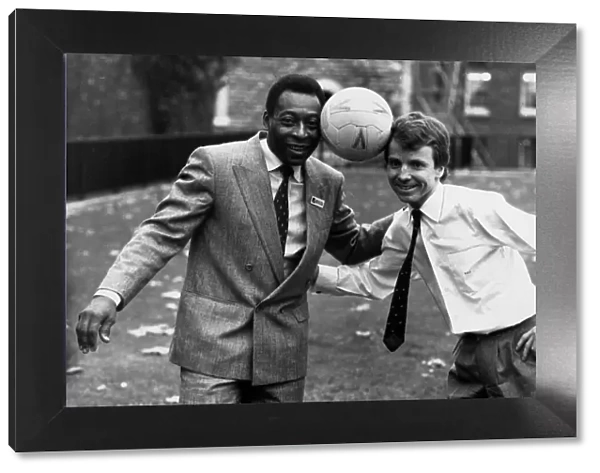 Former Brazilian football star Pele poses with Sports Minister Colin Moynihan MP while