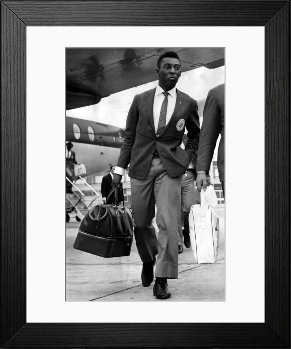 Framed Print : Brazil and Santos football star Pele walks along the tarmac after arriving at Ringway Framed Print : Brazil and Santos football star Pele walks along the tarmac after arriving at Ringway