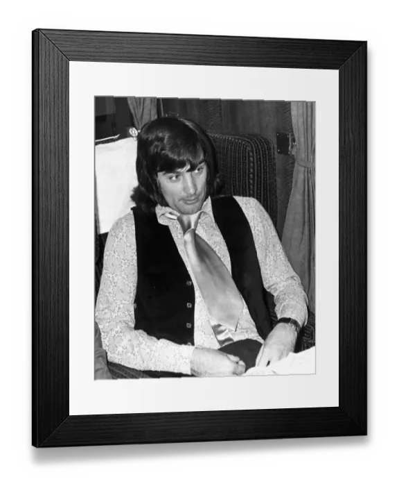 Framed Print : George Best seenn here on a train taking him back to Manchester following a disciplinary Framed Print : George Best seenn here on a train taking him back to Manchester following a disciplinary