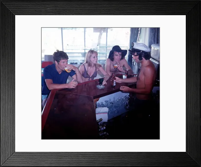 Framed Print : George Best Football serves drinks up to Susan George Actress Framed Print : George Best Football serves drinks up to Susan George Actress