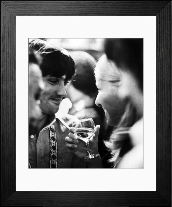 Framed Print : Manchester United footballer George Best talking to his girlfriend Eva Haraldsted holding Framed Print : Manchester United footballer George Best talking to his girlfriend Eva Haraldsted holding