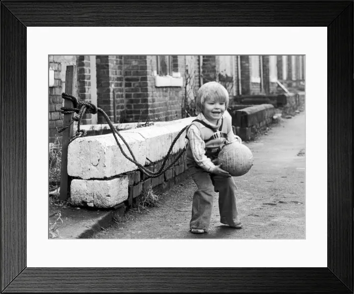 Framed Print : Two year old Jeffrey Metcalfe who has nearly been run over several times is now tied up Framed Print : Two year old Jeffrey Metcalfe who has nearly been run over several times is now tied up