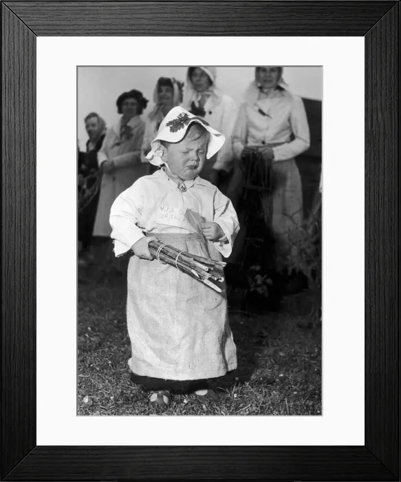 Framed Print : Oak Apple day in Wishford, Wiltshire. 22 month old Wendy Goodman is unhappy after being Framed Print : Oak Apple day in Wishford, Wiltshire. 22 month old Wendy Goodman is unhappy after being