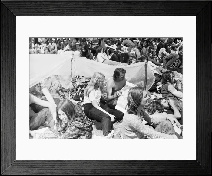 Framed Print : Reading Pop Festival. Young festival goers with their plastic sheet to protect Framed Print : Reading Pop Festival. Young festival goers with their plastic sheet to protect