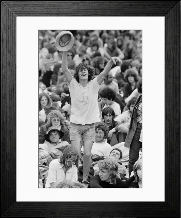 Framed Print : Reading Pop Festival. A happy Music fan watching the bands performing on the main Framed Print : Reading Pop Festival. A happy Music fan watching the bands performing on the main