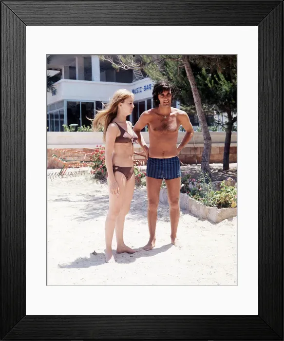 Framed Print : George Best football player and Susan George actress on holiday in Palma Nova Majorca Framed Print : George Best football player and Susan George actress on holiday in Palma Nova Majorca