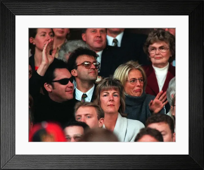 Framed Print : Vic Reeves and Ulrika Jonsson TV Presenter sitting in the stands at Old Trafford to watch