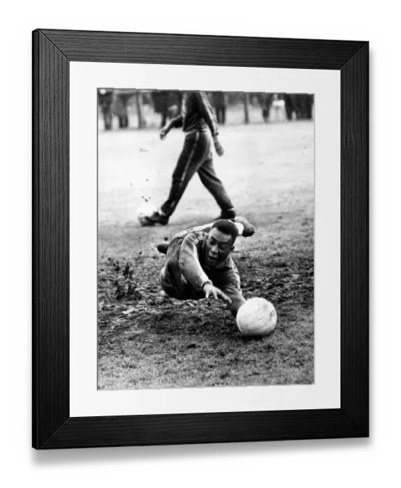 Framed Print : Brazilian football star Pele takes a turn in goal in a training session at Bolton during Framed Print : Brazilian football star Pele takes a turn in goal in a training session at Bolton during