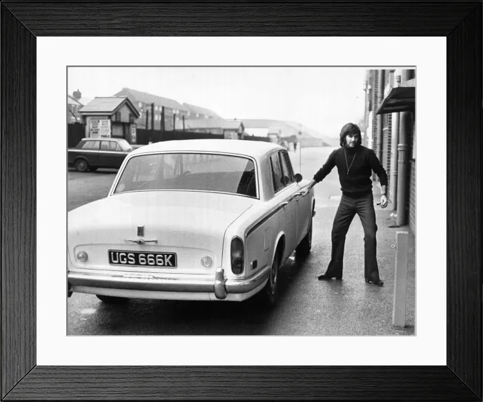 Framed Print : Manchester United footballer George Best seen here arriving at Old Trafford for a