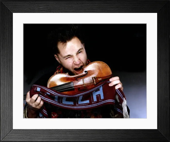 Framed Print : Nigel Kennedy Violinist Making to bite violin holding Aston Villa scarf