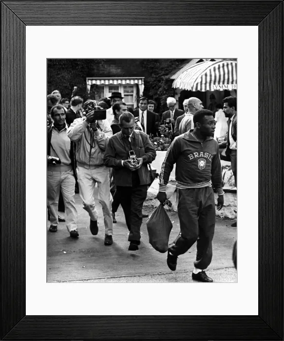 Framed Print : Brazilian football star Pele surrounded by photographers