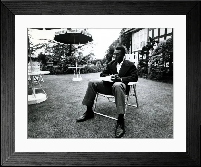 Framed Print : Brazilian football star Pele relaxes in an English country garden at the Brazilian team Framed Print : Brazilian football star Pele relaxes in an English country garden at the Brazilian team