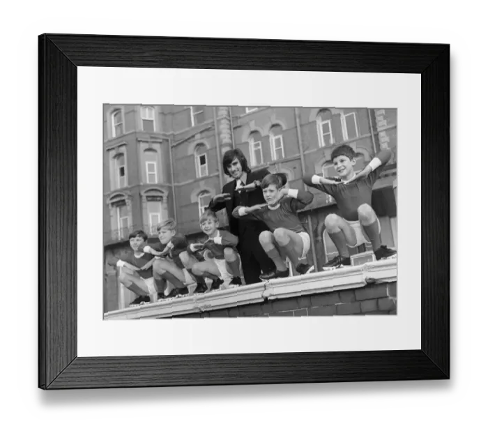 Framed Print : George Best with children from a Manchester children Framed Print : George Best with children from a Manchester children