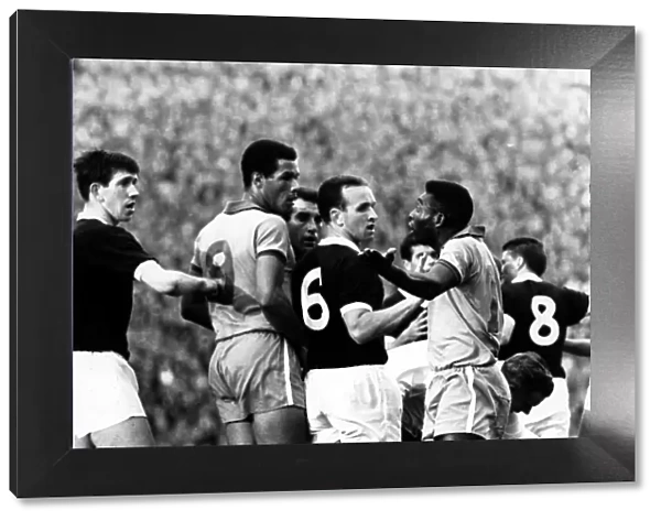 Brazilian football star Pele arguing with Scotland players after clashing with Billy