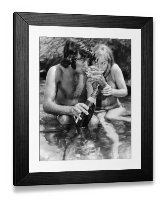 Framed Print : The champagne lifestyle for football star George Best seen here sipping Champagne with Framed Print : The champagne lifestyle for football star George Best seen here sipping Champagne with