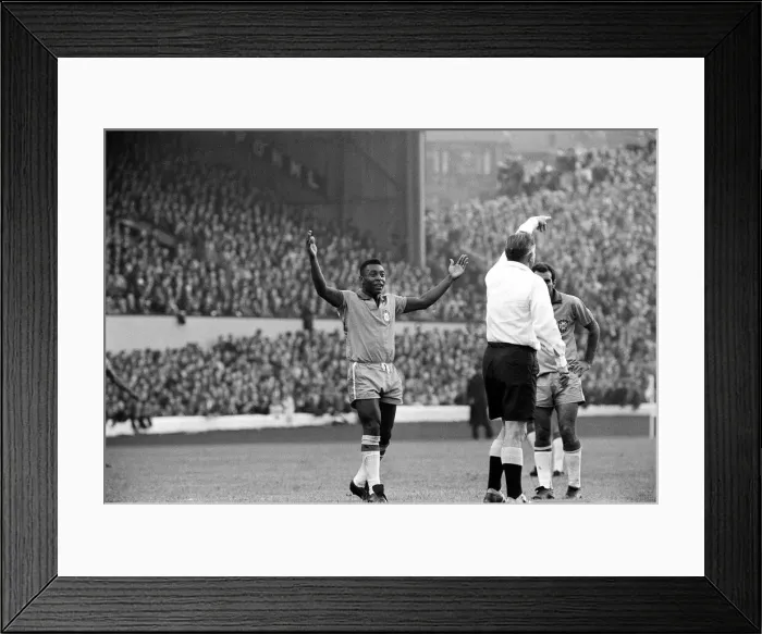 Framed Print : Pele July 1966 raises his hands as the referee awards a free kick in the Scotland v