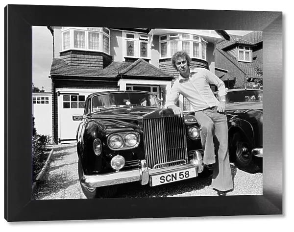 Charlie George football player of Arsenal September 1975 Outside his house leaning