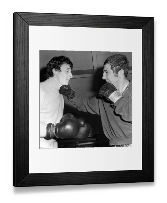 Framed Print : Mike Summerbee gets a right hander from heavyweight boxer Kevin Madden in the Gym where