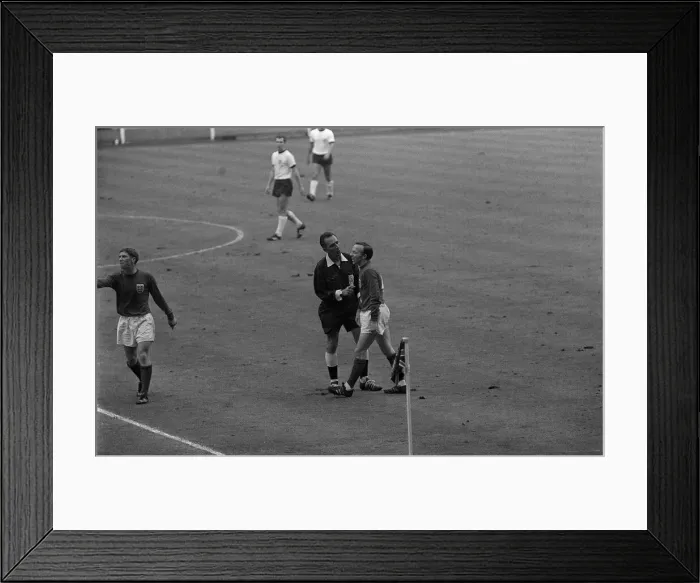 Framed Print : Nobby Stiles is spoken to the referee 30th July 1966. as Alan Ball makes a point Framed Print : Nobby Stiles is spoken to the referee 30th July 1966. as Alan Ball makes a point