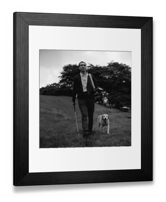 Framed Print : Bob Stokoe football manager relaxes away from it all with his dog Jess and a game of golf