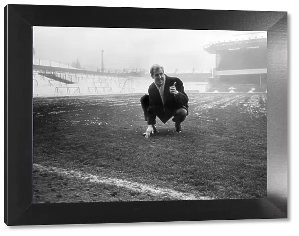 Arsenals Ian Ure inspecting the pitch at Highbury. 12th January 1968