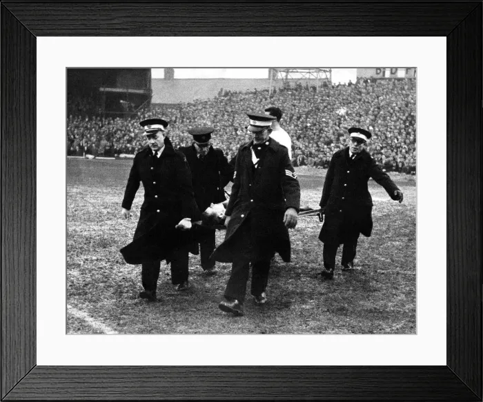Framed Print : Brian Clough is carried from the field by the St John Ambulance Brigade after injuring