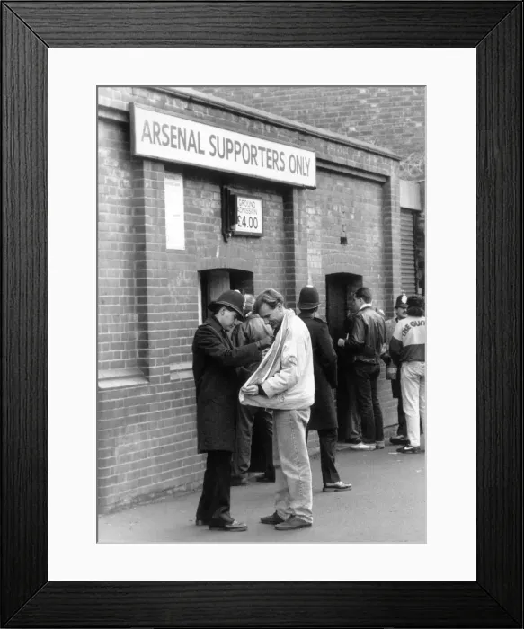 Framed Print : Police checking a fans jacket outside Highbury. 5th March 1990 Framed Print : Police checking a fans jacket outside Highbury. 5th March 1990