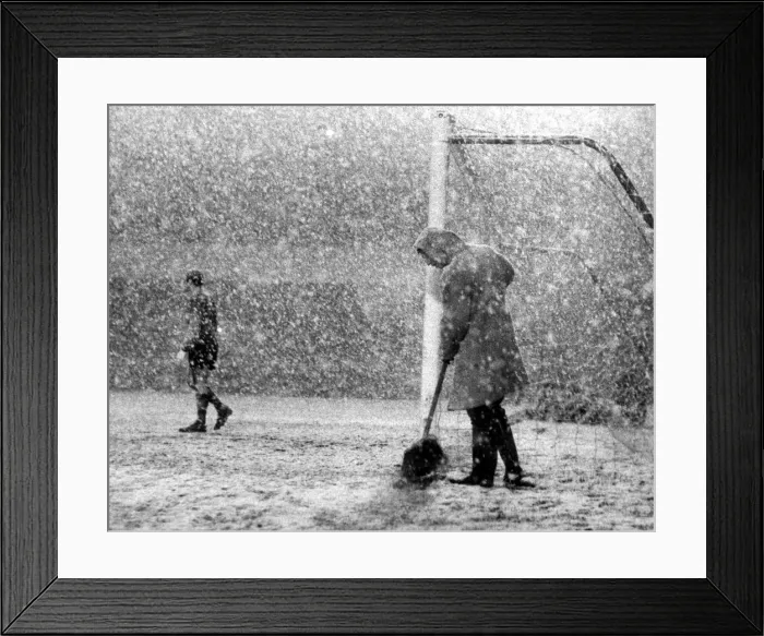 Framed Print : Arsenal v. Sheffield Wednesday. A Groundsman sweeps the line clear while Peter Framed Print : Arsenal v. Sheffield Wednesday. A Groundsman sweeps the line clear while Peter