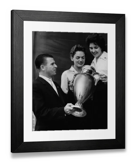 Framed Print : Ferenc Puskas Real Madrid football player shows off the European Cup Trophy to two