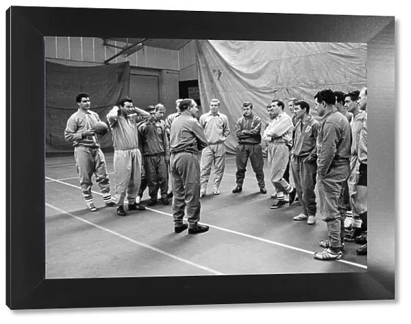 New England manager Alf Ramsey talks to his squad of players at the RAF Arena in Stanmore