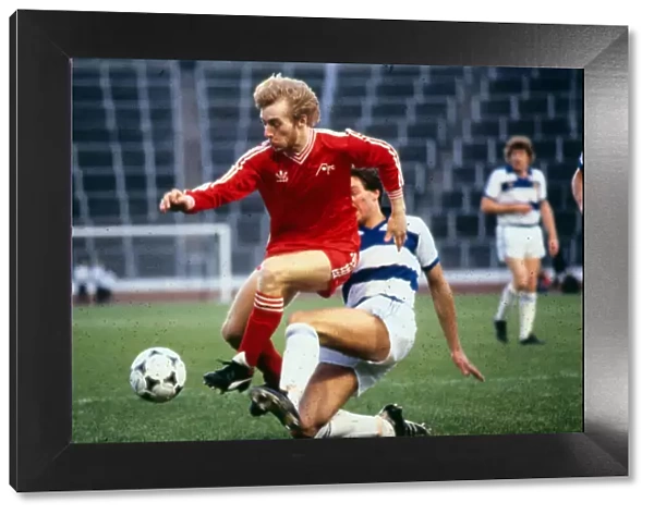 Steve Archibald Aberdeen football player is tackled by Joe McLaughlin of Morton in a