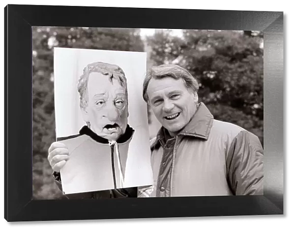 Bobby Robson England manager pictured with a photograph of his spitting image puppet