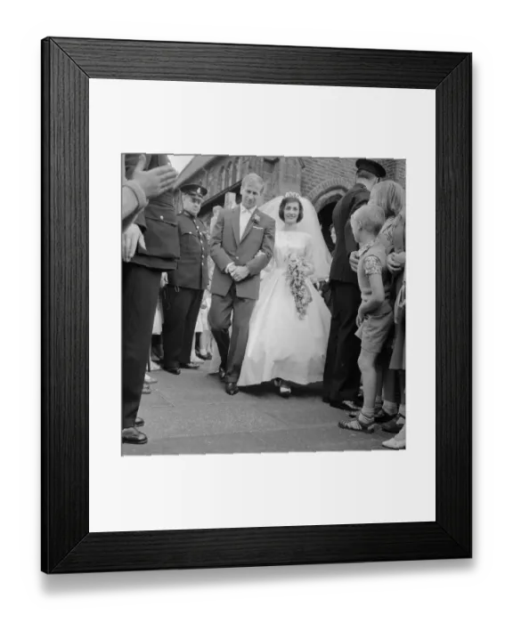 Framed Print : Manchester United and England footballer Bobby Charlton with his bride