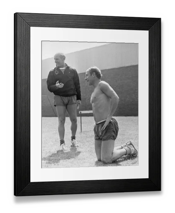 Framed Print : Manchester United footballer Bobby Charlton takes a breather as he sits on his knees Framed Print : Manchester United footballer Bobby Charlton takes a breather as he sits on his knees