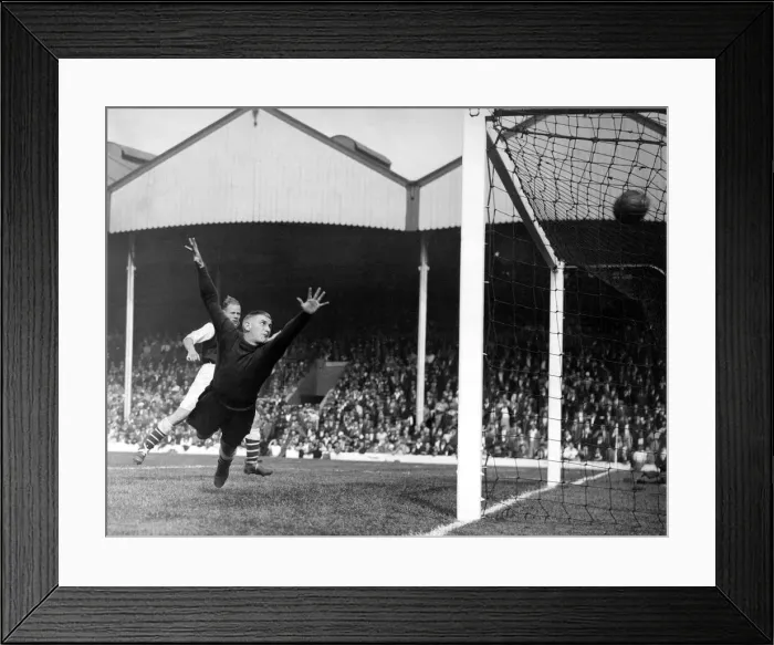 Framed Print : Frank Moss, football player of Arsenal FC, dives in an attempt to save a goal. c Framed Print : Frank Moss, football player of Arsenal FC, dives in an attempt to save a goal. c