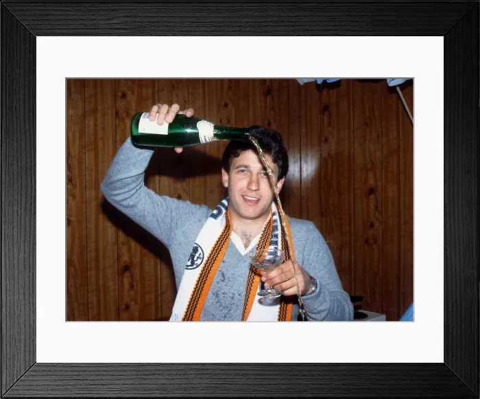 Framed Print : Ralph Milne pouring champagne from bottle January 1989