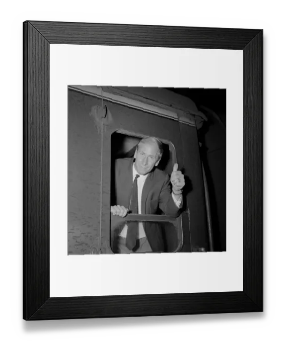 Framed Print : England footballer Bobby Charlton gives the thumbs up gesture as he leans out of
