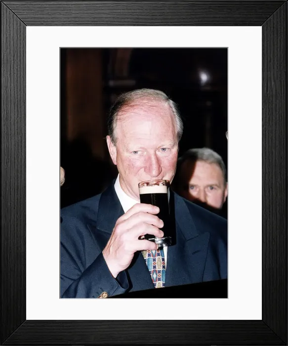 Framed Print : Jack Charlton Manager of the Republic of Ireland Football Team enjoys a glass of Guinness