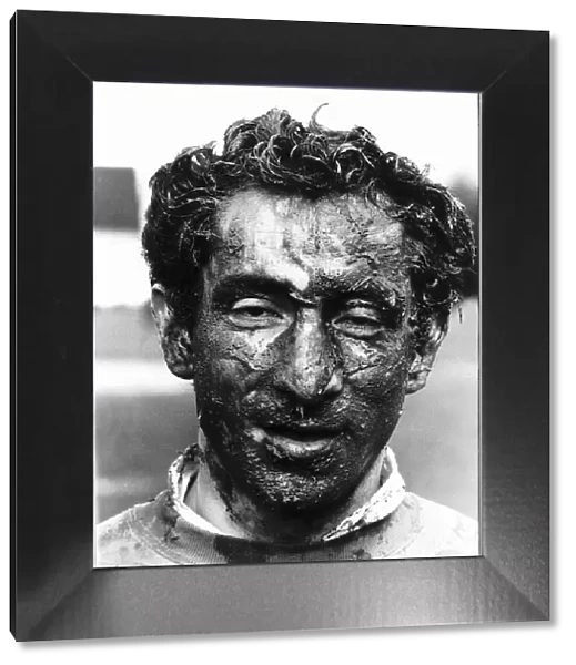 Ossie Ardiles football player covered in mud. March 1982