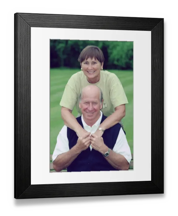 Framed Print : Bobby Charlton with wife Norma after news of his knighthood. 10th June 1994