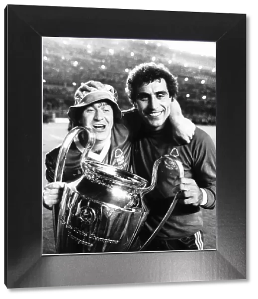 Nottingham Forest players John Robertson and Peter Shilton celebrate with the trophy