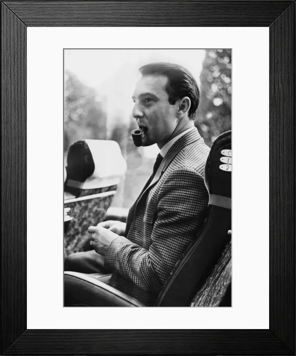Framed Print : Jimmy Greaves relaxes with a pipe after training at Roehampton. 4th May 1965 Framed Print : Jimmy Greaves relaxes with a pipe after training at Roehampton. 4th May 1965