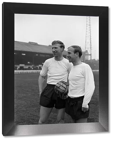 Brothers Jack Charlton (l) and Bobby Charlton (r) pose for pictures ahead of training