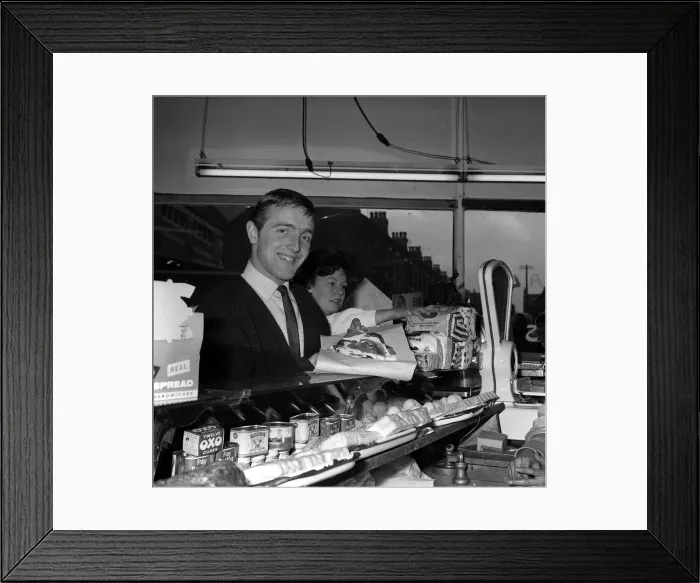 Framed Print : Liverpool left winger Peter Thompson buys the Bacon at the local shop for his Framed Print : Liverpool left winger Peter Thompson buys the Bacon at the local shop for his