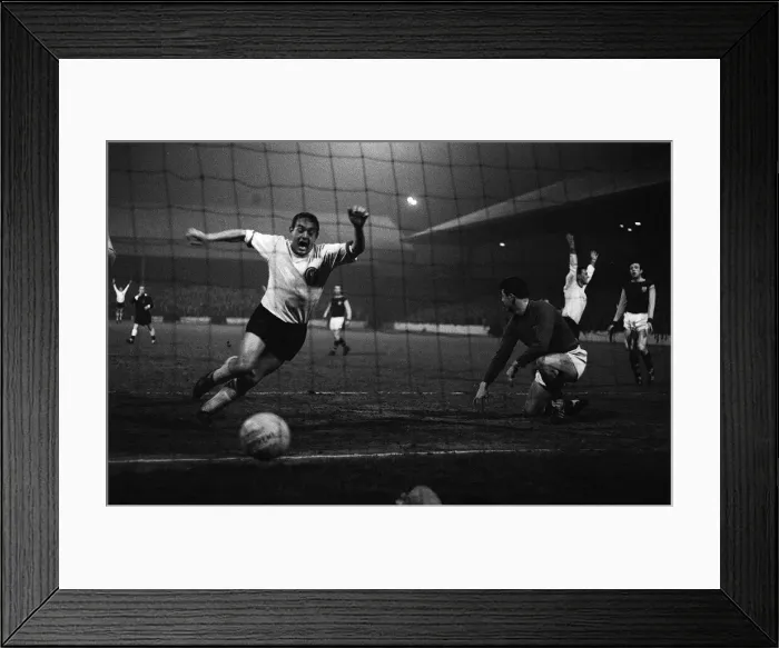 Framed Print : Ian St John of Liverpool scores against Burnley at Turf Moor Framed Print : Ian St John of Liverpool scores against Burnley at Turf Moor
